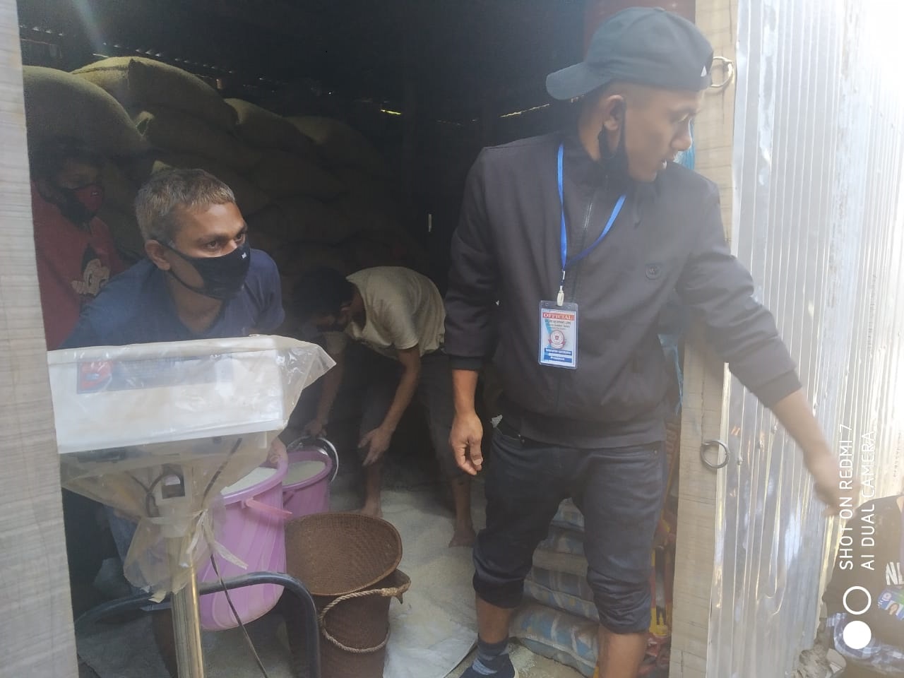  Plvs of Kamjong assisting in distribution of rice at Kamjong District